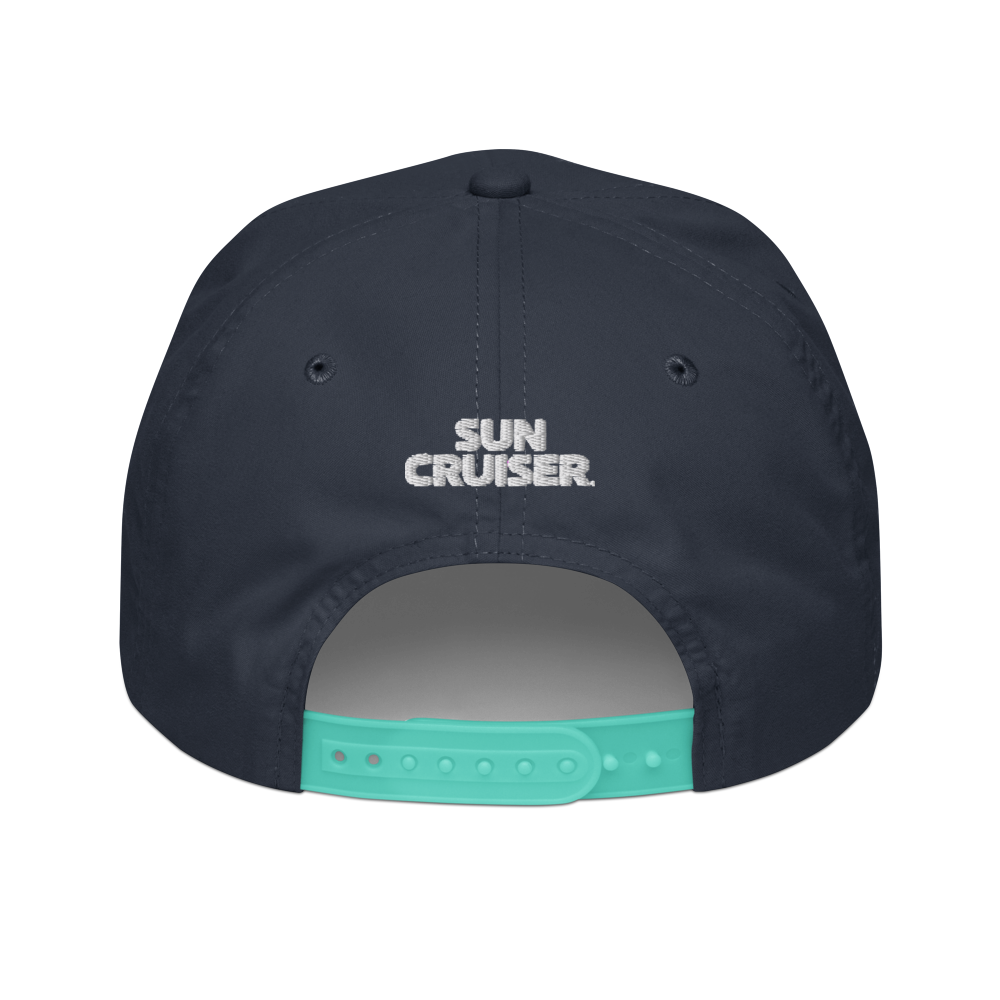 Back view of a dark navy blue snapback cap with 'SUN CRUISER.' printed in white on the front and a turquoise adjustable strap at the back, shown on a plain white background.