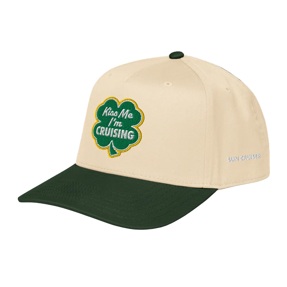 Beige and green cap with shamrock design and text on a white background