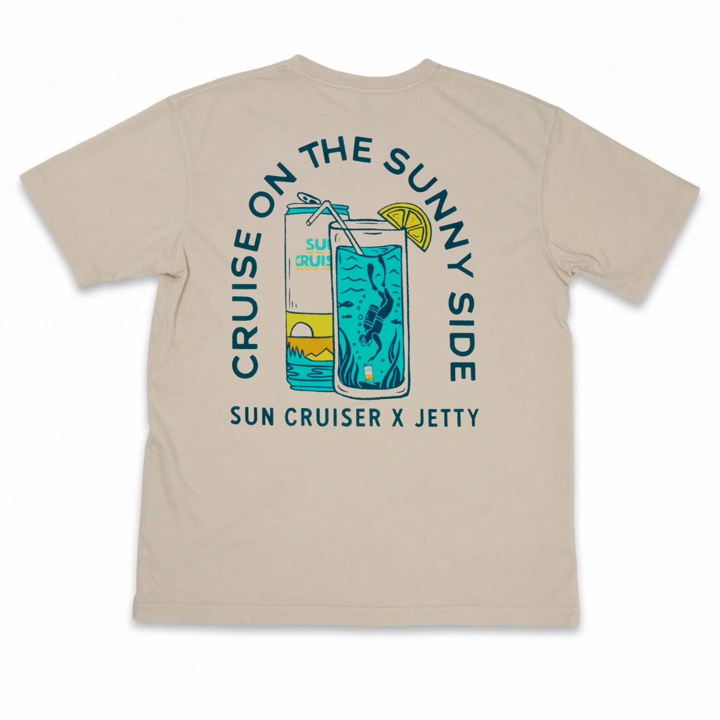 Tan tee shirt with Cruise on the sunny side graphic. Sun Cruiser x Jetty text at the bottom and can and tropical drink. 