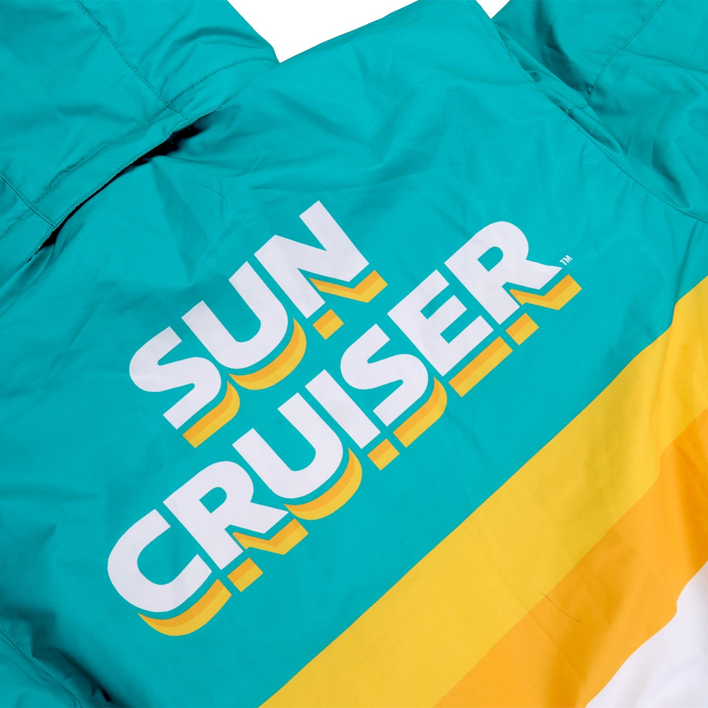 Rear of a Teal and yellow ski suit with 'Sun Cruiser' text
