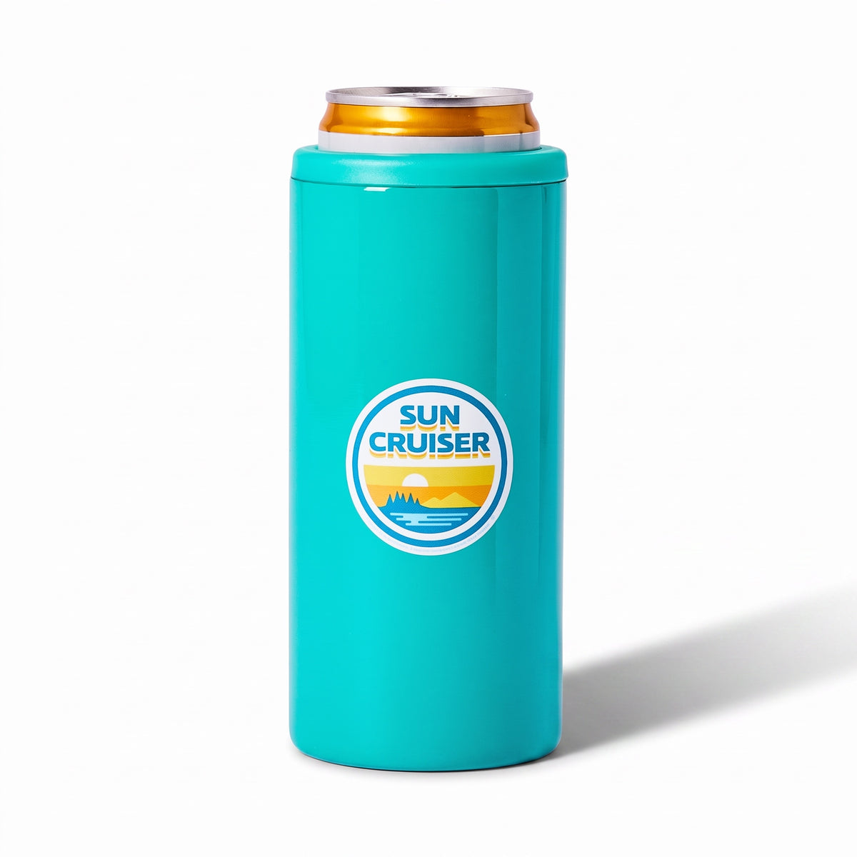 A turquoise insulated can cooler holding a silver aluminum can with a gold-orange rim, featuring a circular 'Sun Cruiser' logo on the front, set against a clean white background with a soft shadow.